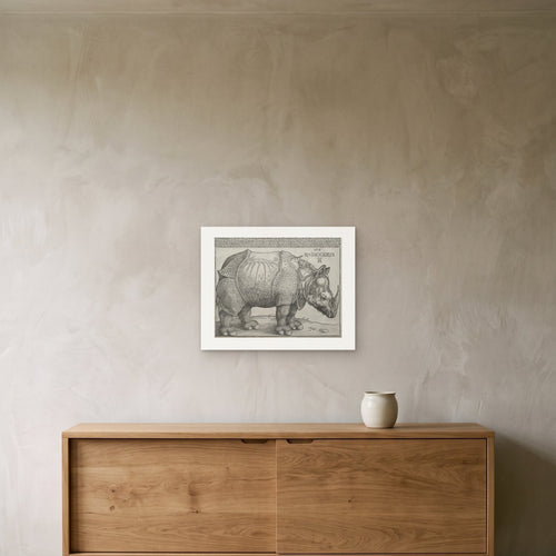 Dürer's Rhinoceros as a 50 × 40 cm giclée print, unframed, hung 25 cm above a 140 cm sideboard