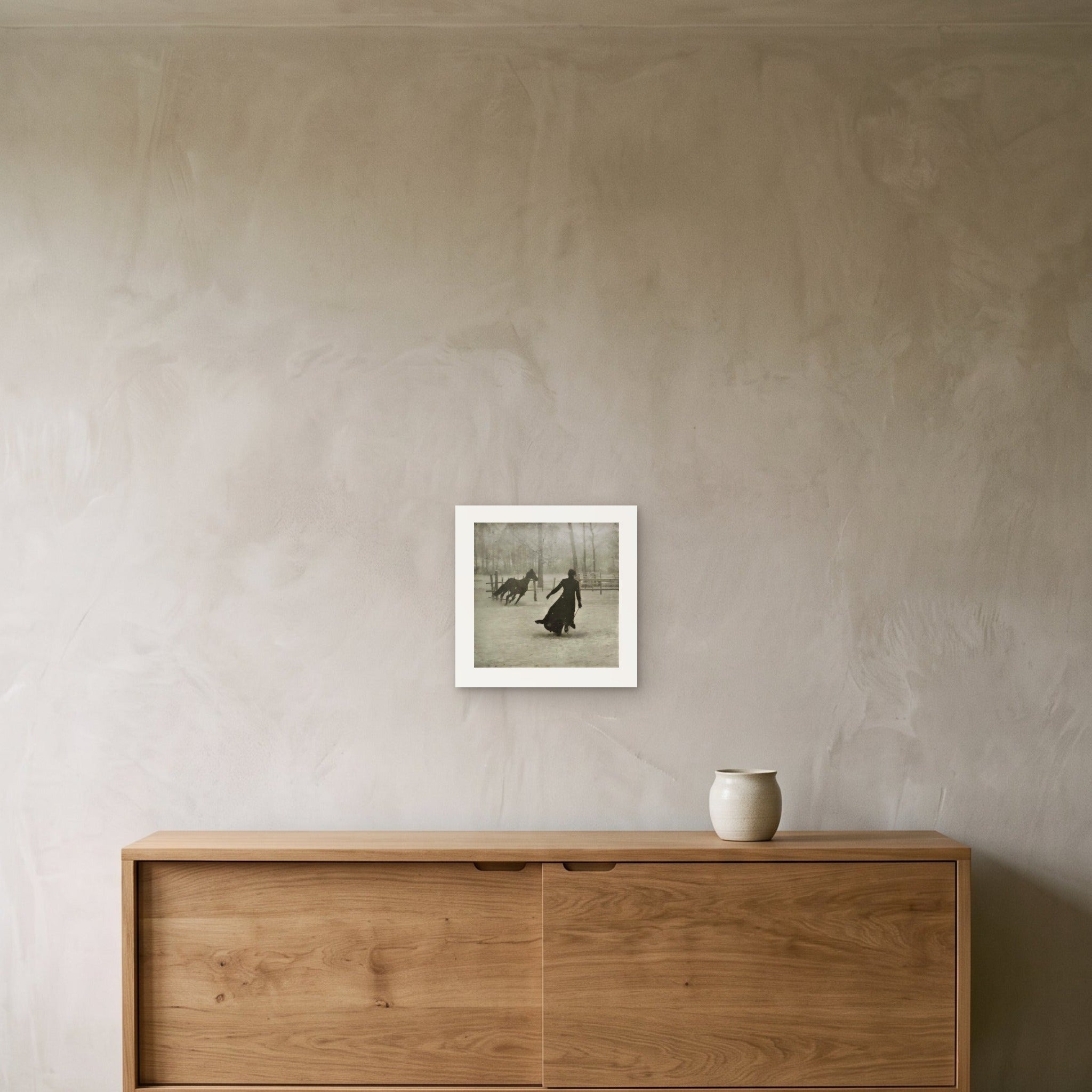 The photograph as a 30 × 30 cm giclée print, unframed, hung 25 cm above a 140 cm sideboard
