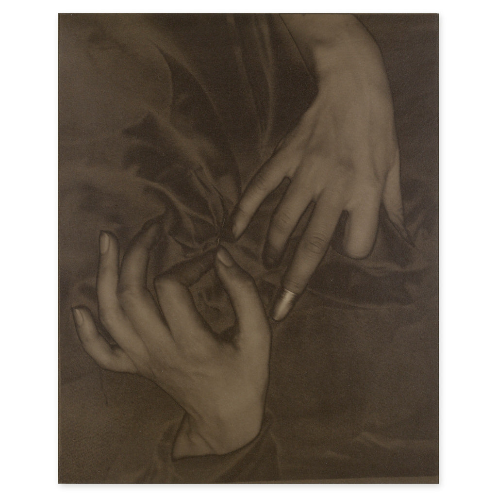 Alfred Stieglitz, Georgia O'Keeffe — Hands and Thimble, 1919 — the palladium print reproduced whole: two hands against dark cloth, a thimble on the middle finger of the upper hand