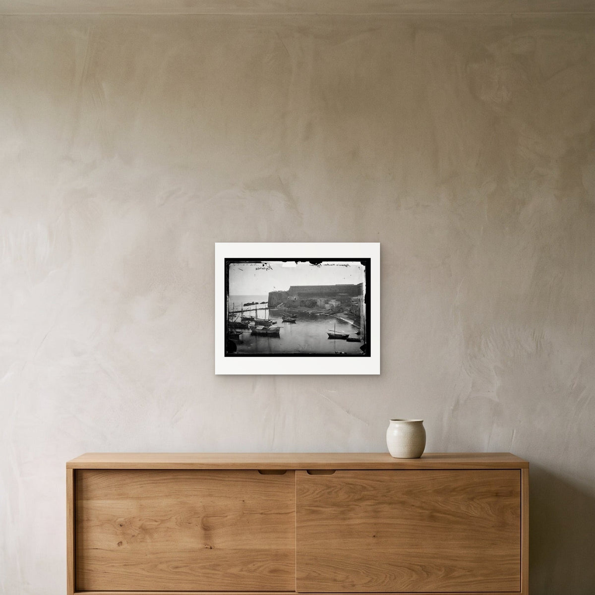 John Thomson – Kyrenia Harbour, Cyprus, 1878 — the 50 × 40 cm sheet as printed, shown on the wall above a sideboard