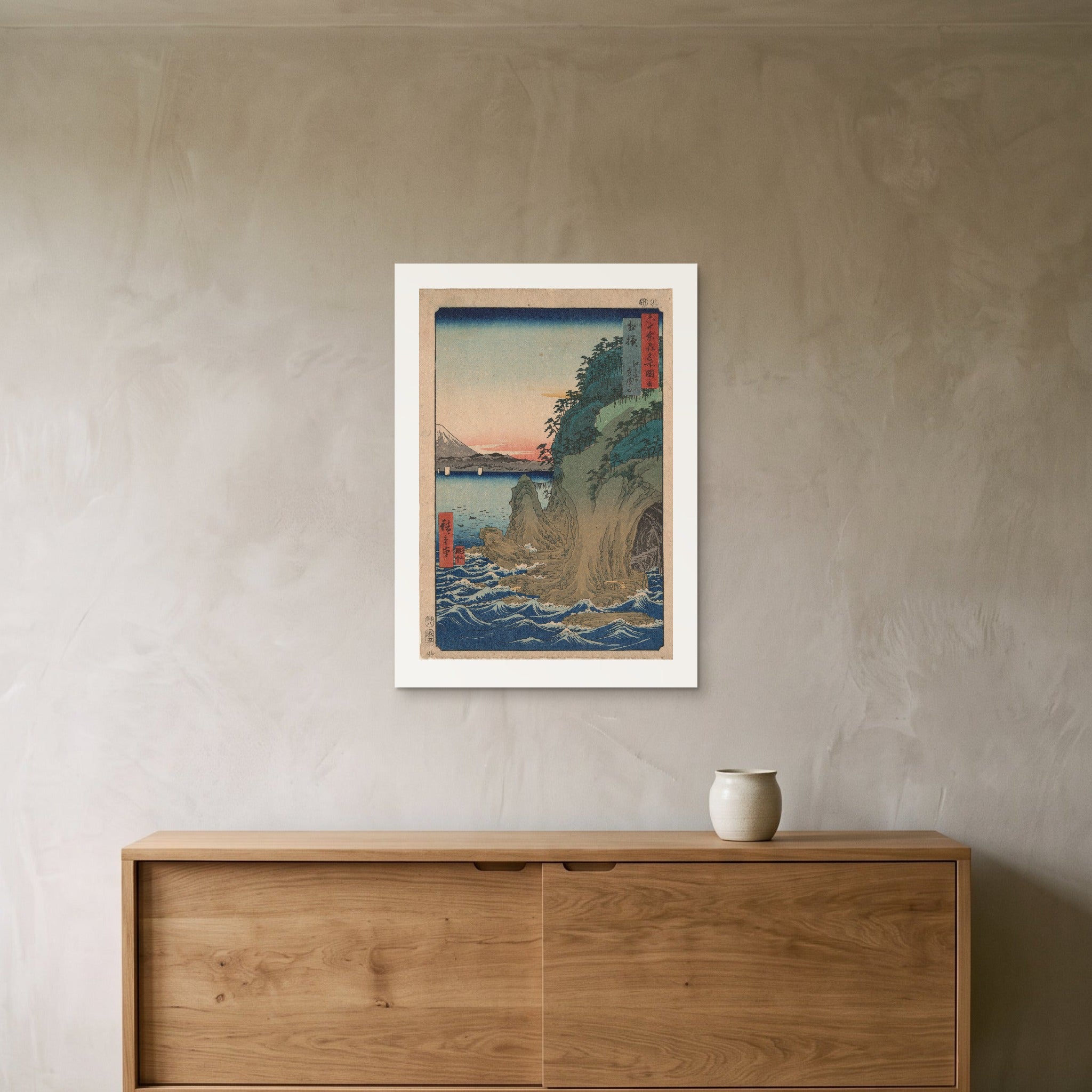 Hiroshige's Caves at Enoshima as a 50 × 70 cm giclée print, unframed, hung 25 cm above a 140 cm sideboard