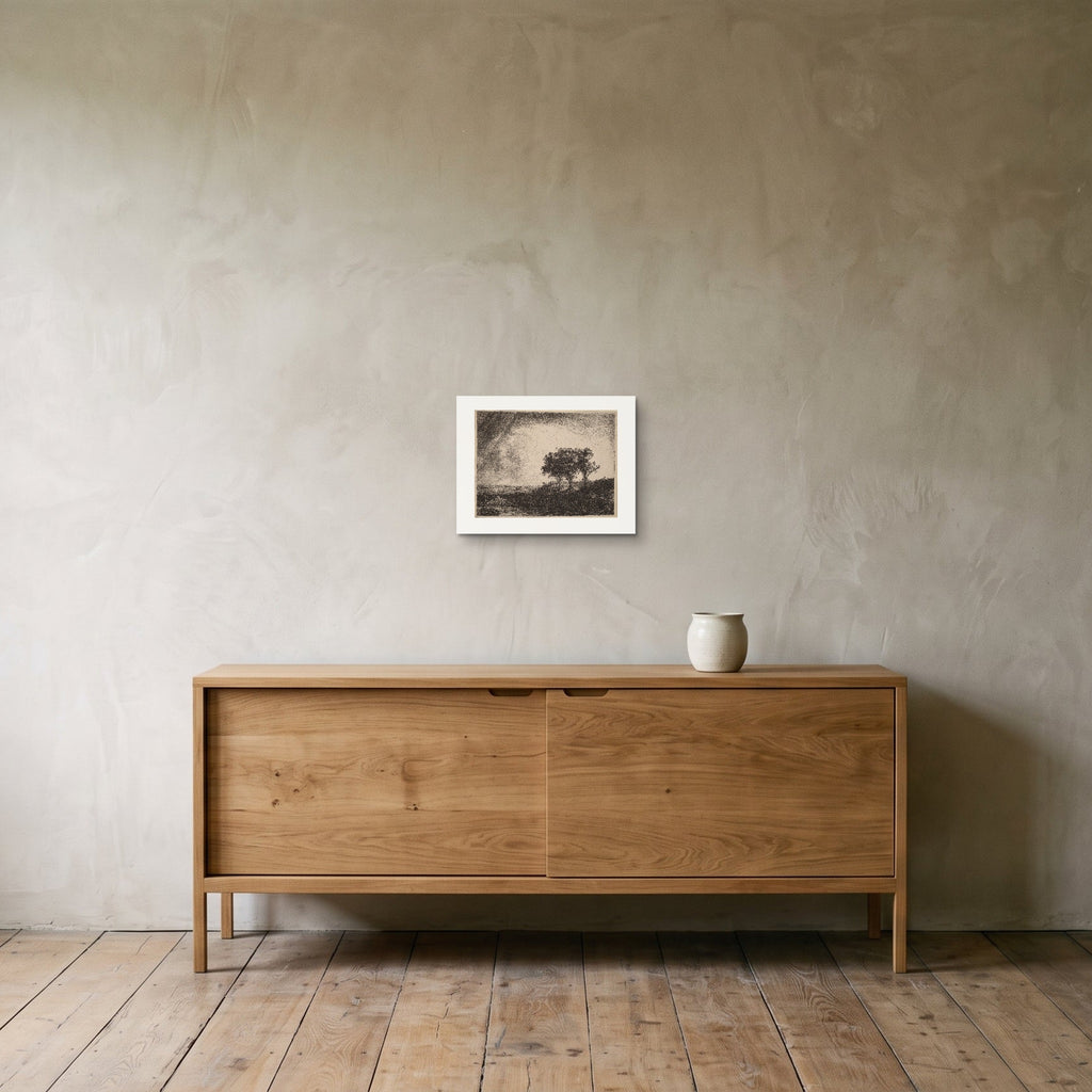 Rembrandt's The Three Trees as a 35 × 27 cm giclée print at the original plate size, unframed, hung 25 cm above a 140 cm sideboard