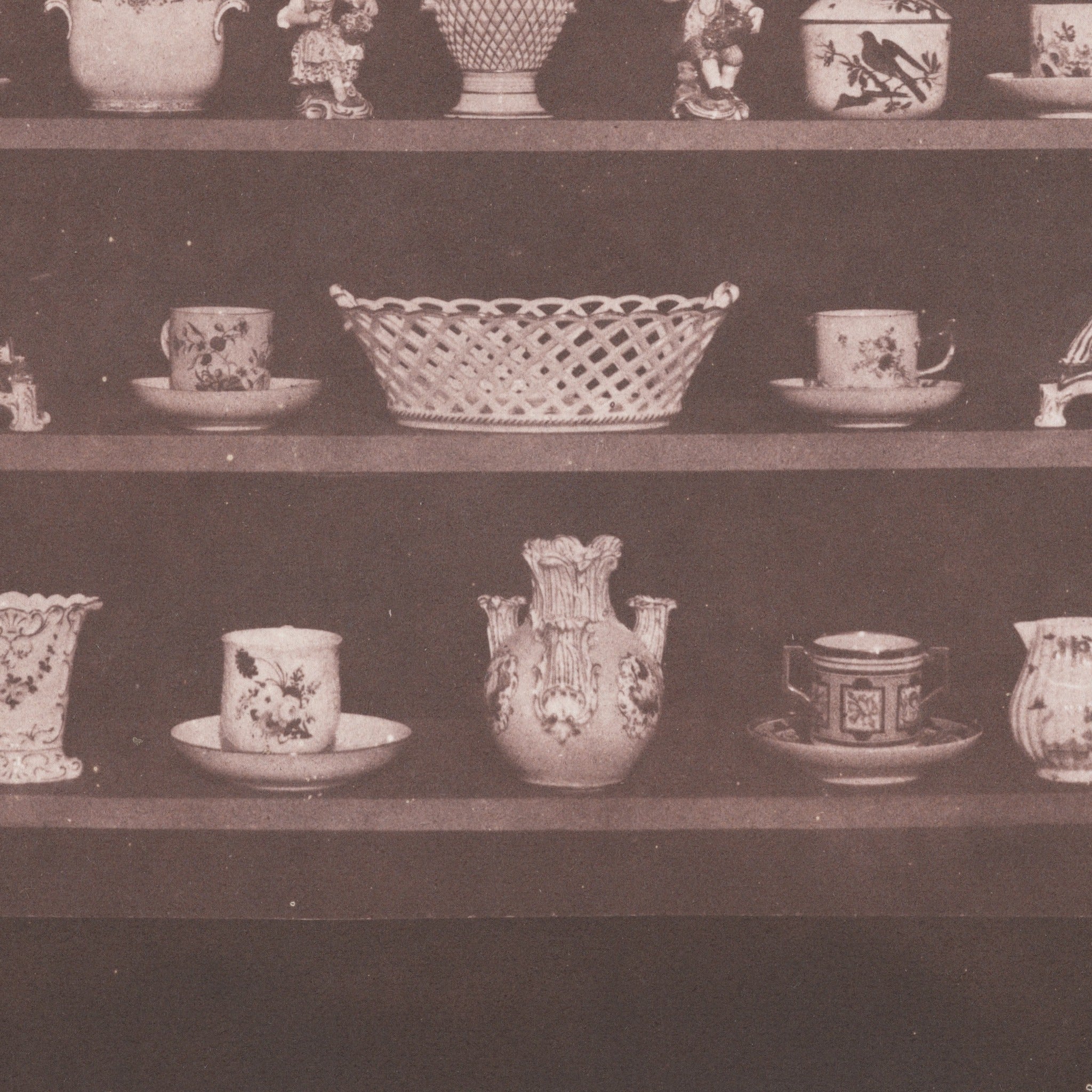 Detail at printed size — the china on its shelves in Talbot's salt print