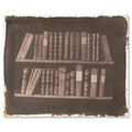 William Henry Fox Talbot, A Scene in a Library, 1844 - the whole salted paper sheet shown flat on white