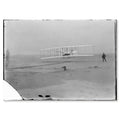 First flight, Kitty Hawk, 17 December 1903 — the whole glass negative as scanned, with its chipped plate border, the lost corner and the stains along the lower edge